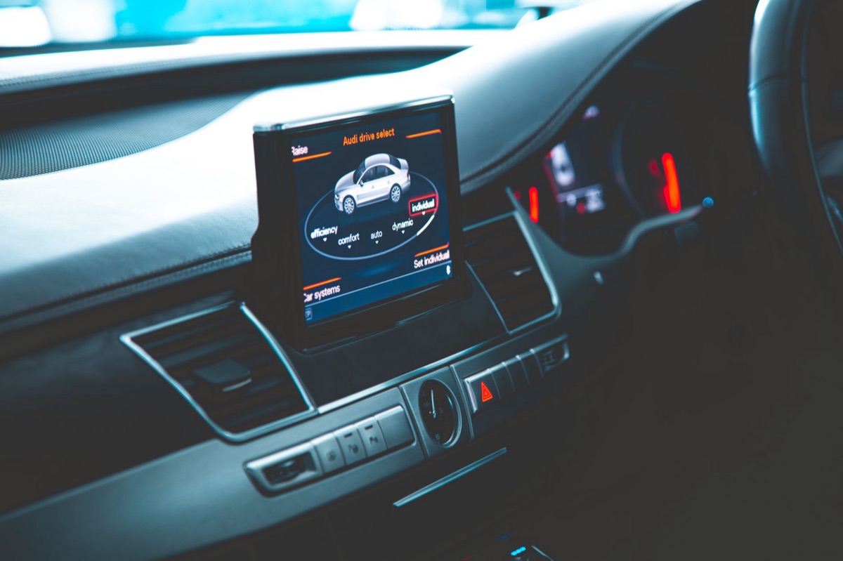 Close-up of a high-tech digital cockpit and software interface in a modern car
