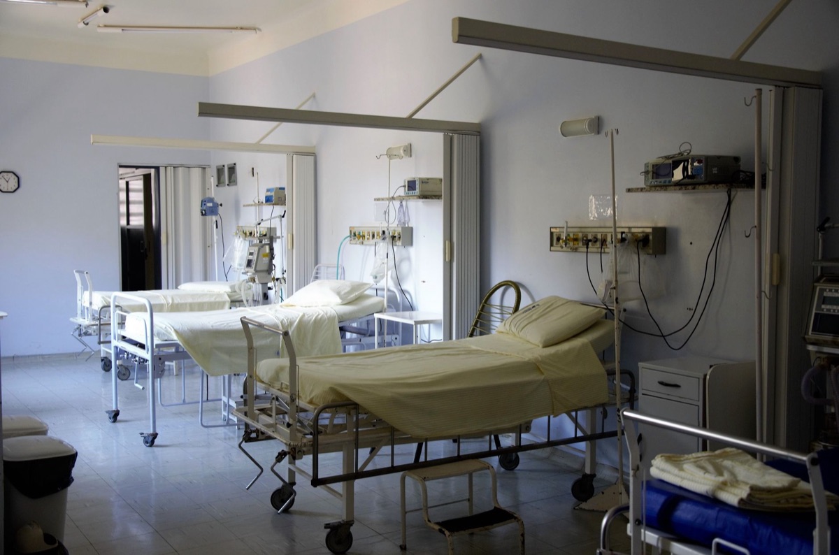 German hospital ward with white beds and medical equipment